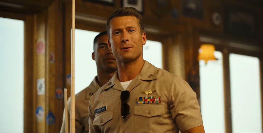 Man Standing in a Navy Shirt