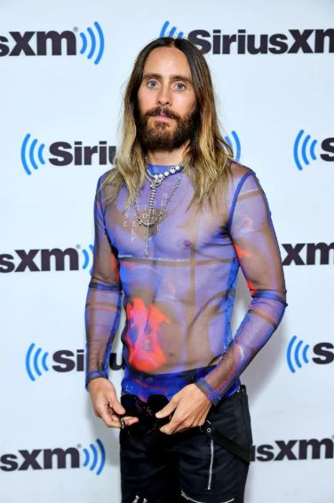 a man in a transparent shirtscreenhollywood.com